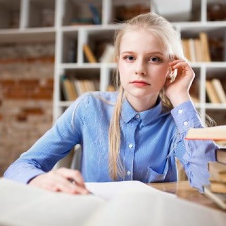 Female student studying and looking into the camera Preparing Students for the Rigors of College Teaching Strategies for Today’s Students (iGen or GenZ)