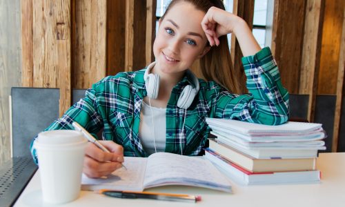 Young student working in library looking into camera Helping Students Learn Despite their Anxiety